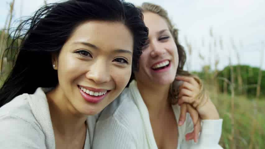 Image result for woman laughing together with friend
