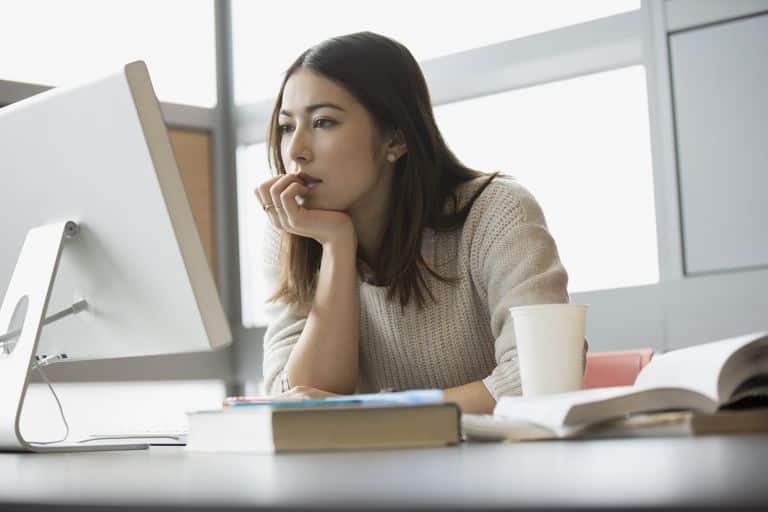 Image result for woman thinking alone at office