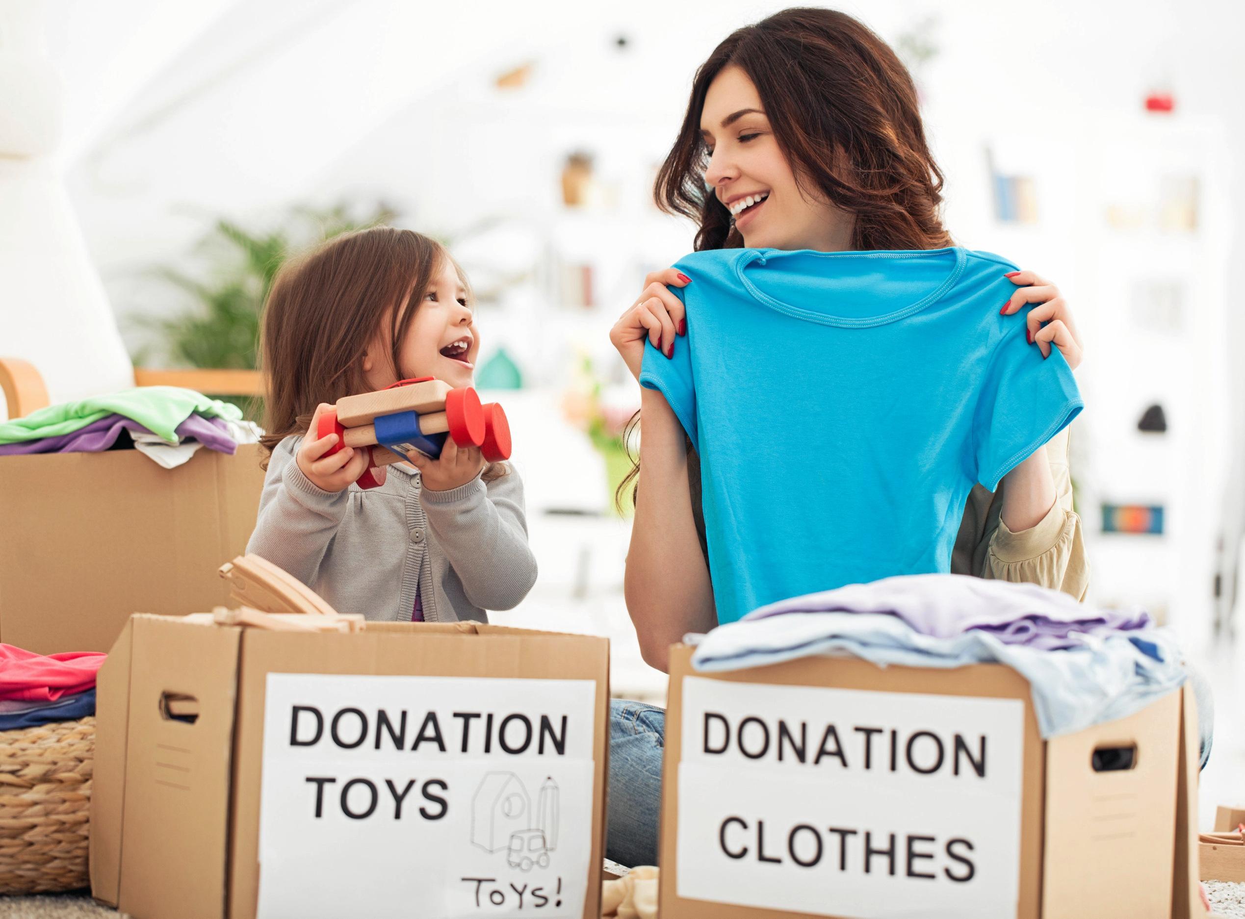 mother-and-daughter-preparing-toys-and-clothes-to-donate-for-charity