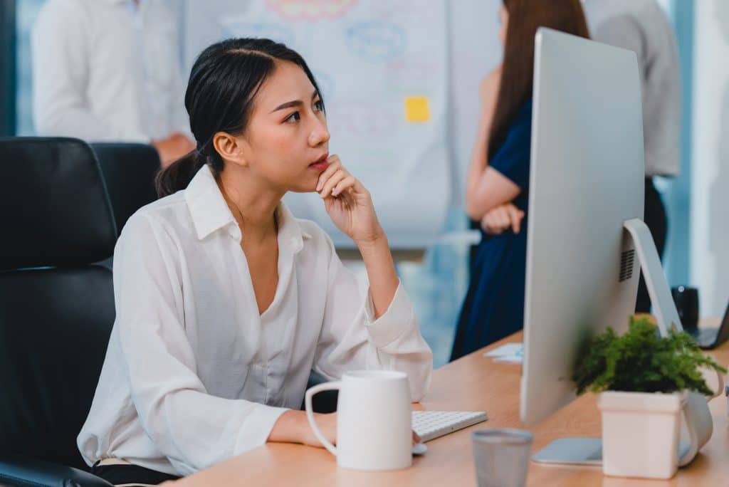 Millennial young Chinese businesswoman working stress out with p - Rimma.co